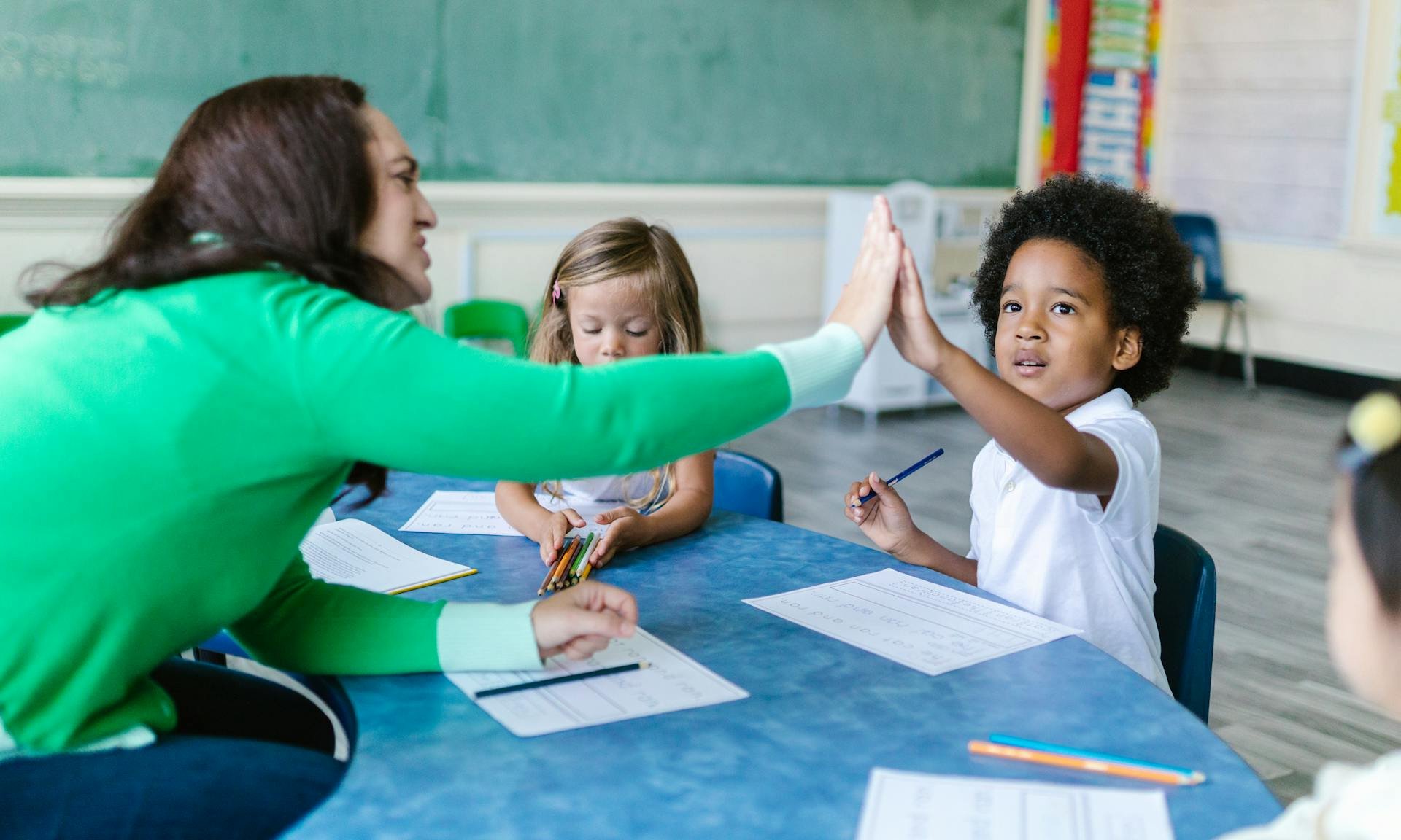 Teacher and child high five